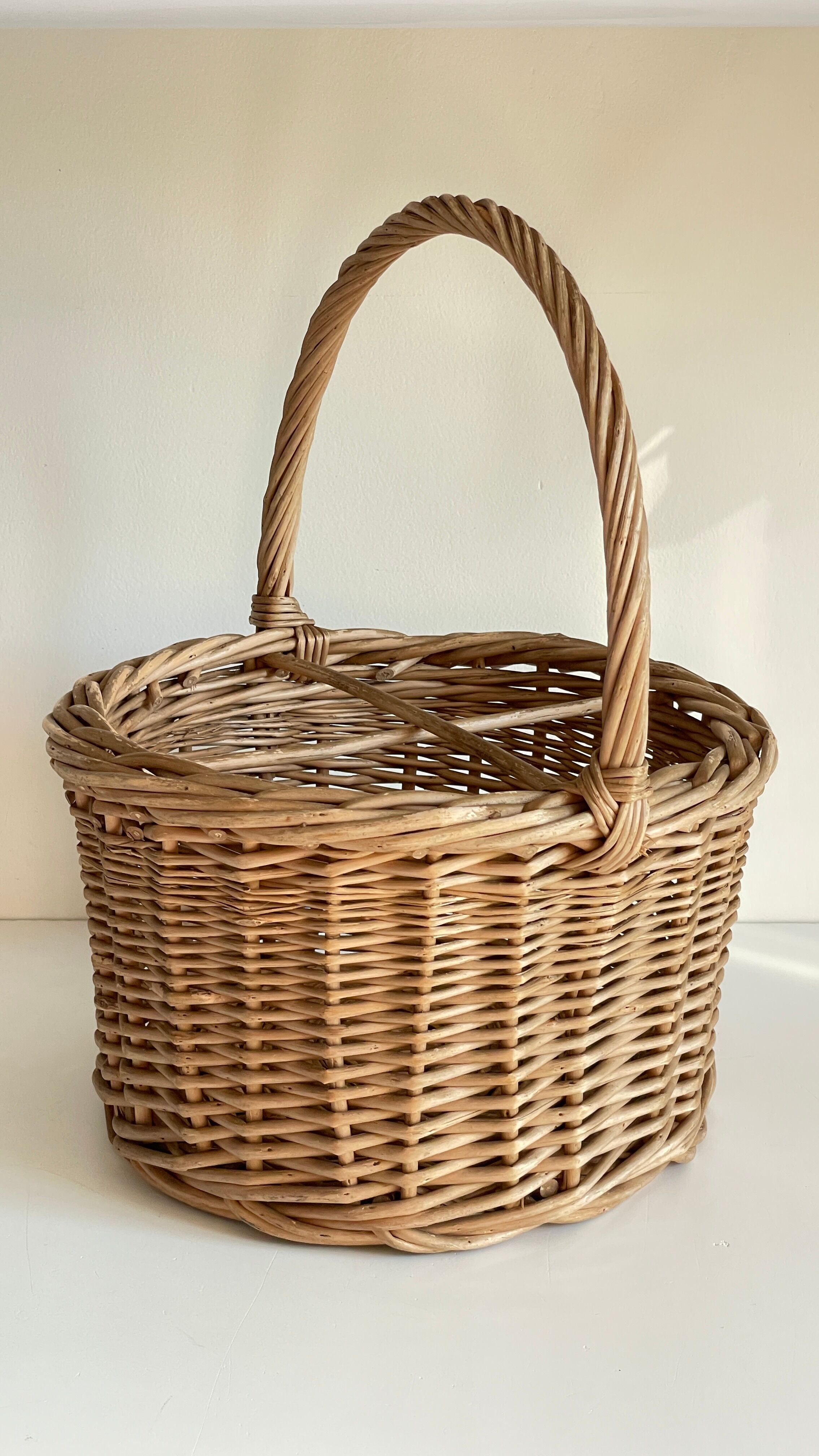 Basket with vintage rattan bottles