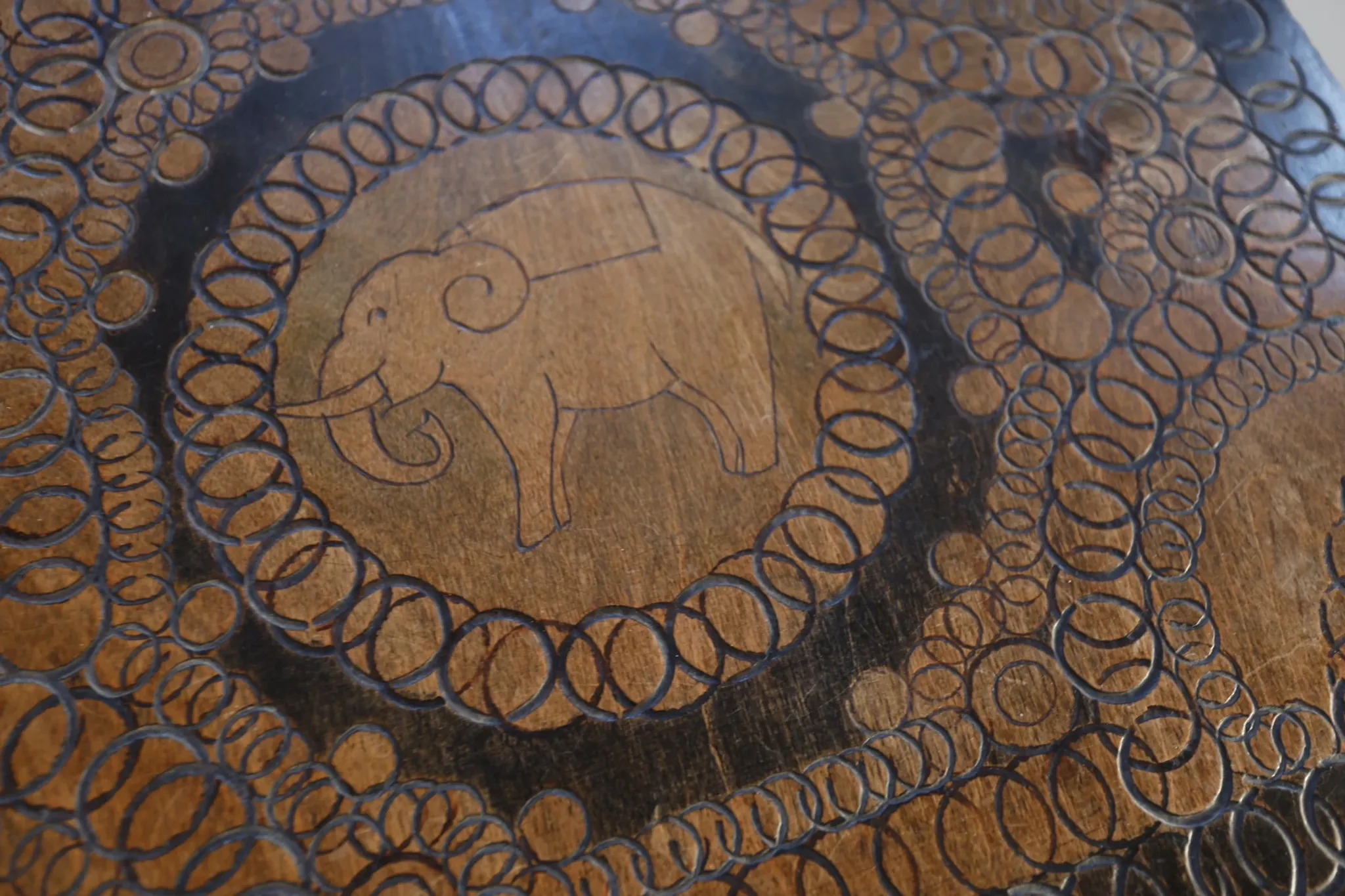 Decorated antique side table with elephant