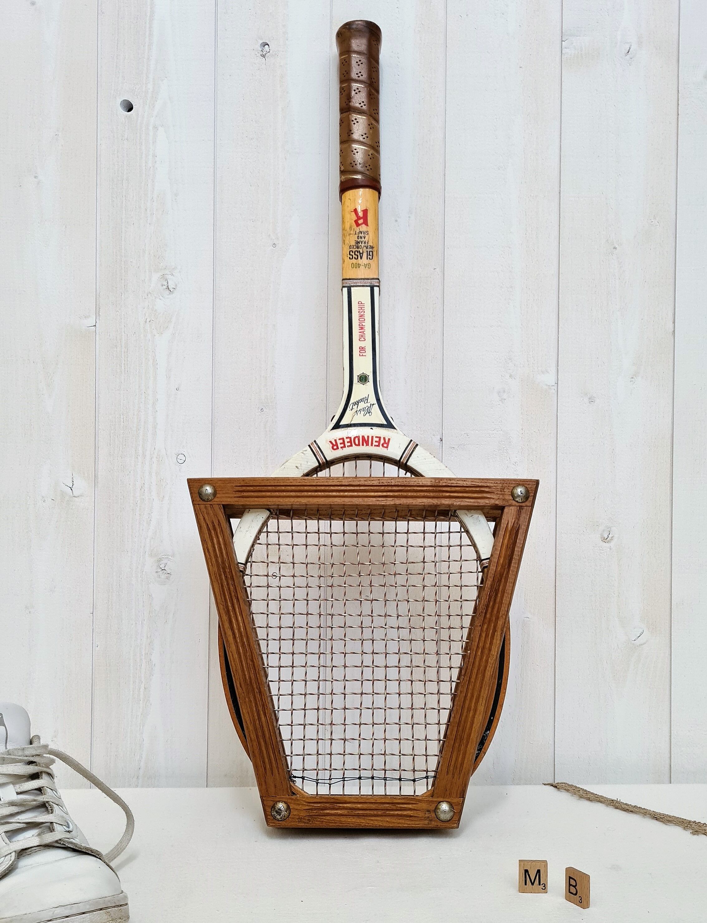 Vintage tennis racket with wooden press