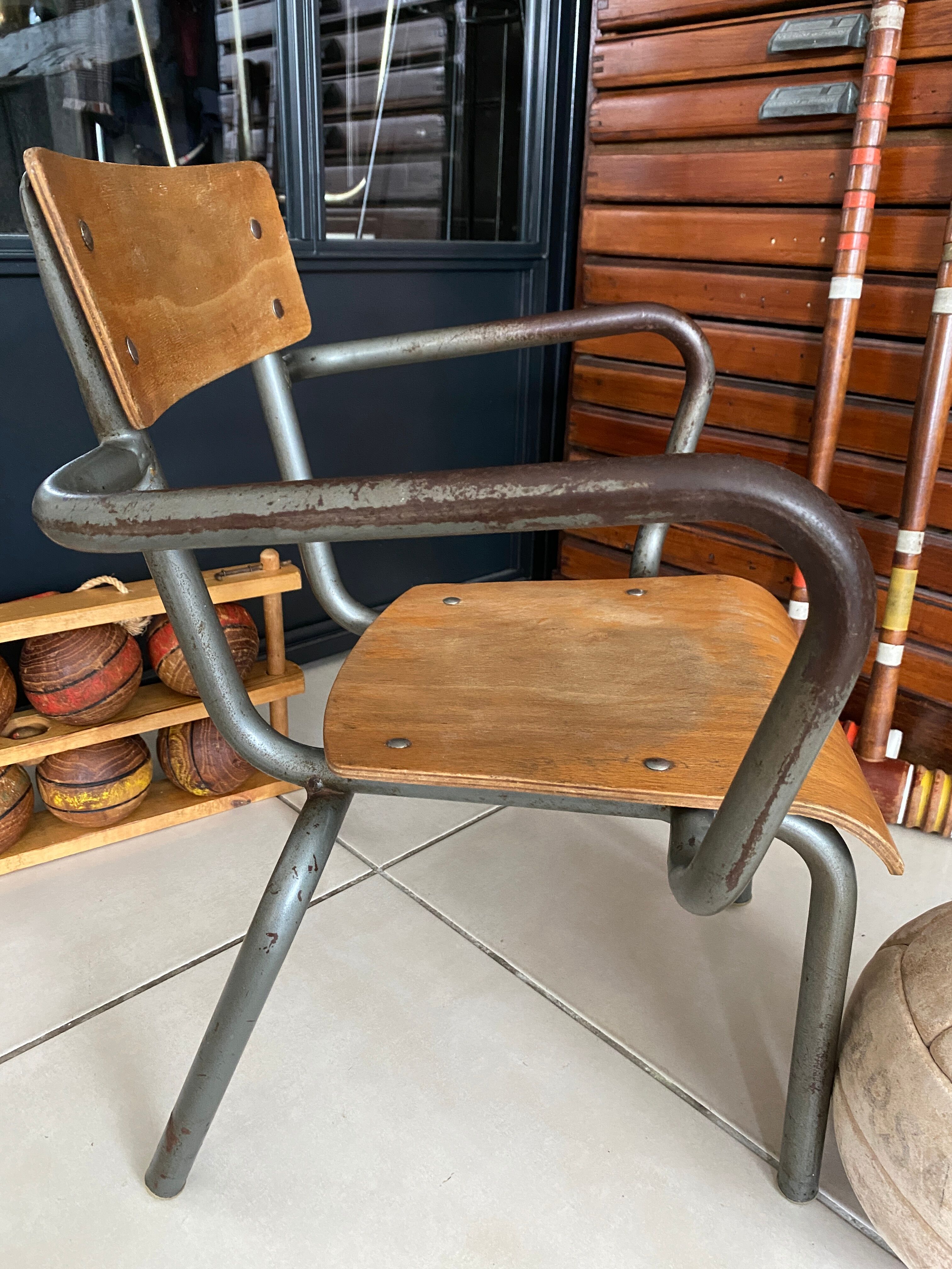 Old Mullca school chair with armrests