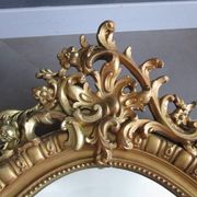 Antique mirror in wood and gilded stucco