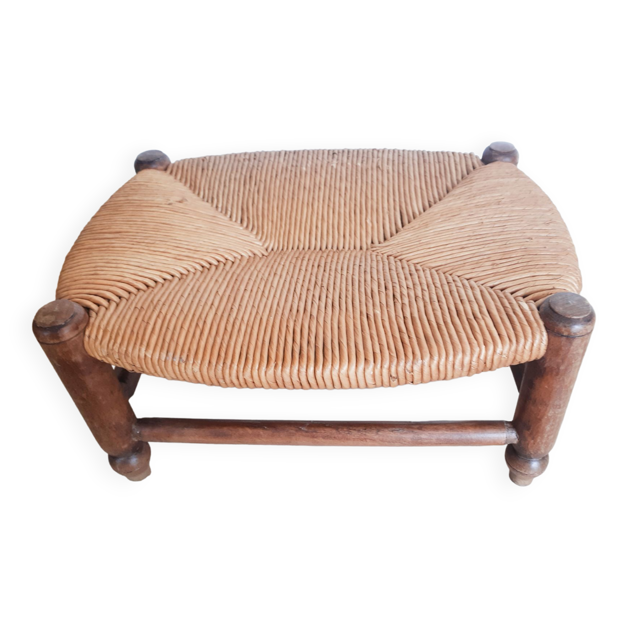 Low wooden stool and straw