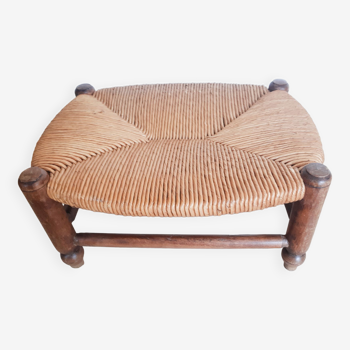 Low wooden stool and straw