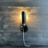 Old black metal and brass wall light, adjustable, 1930s.