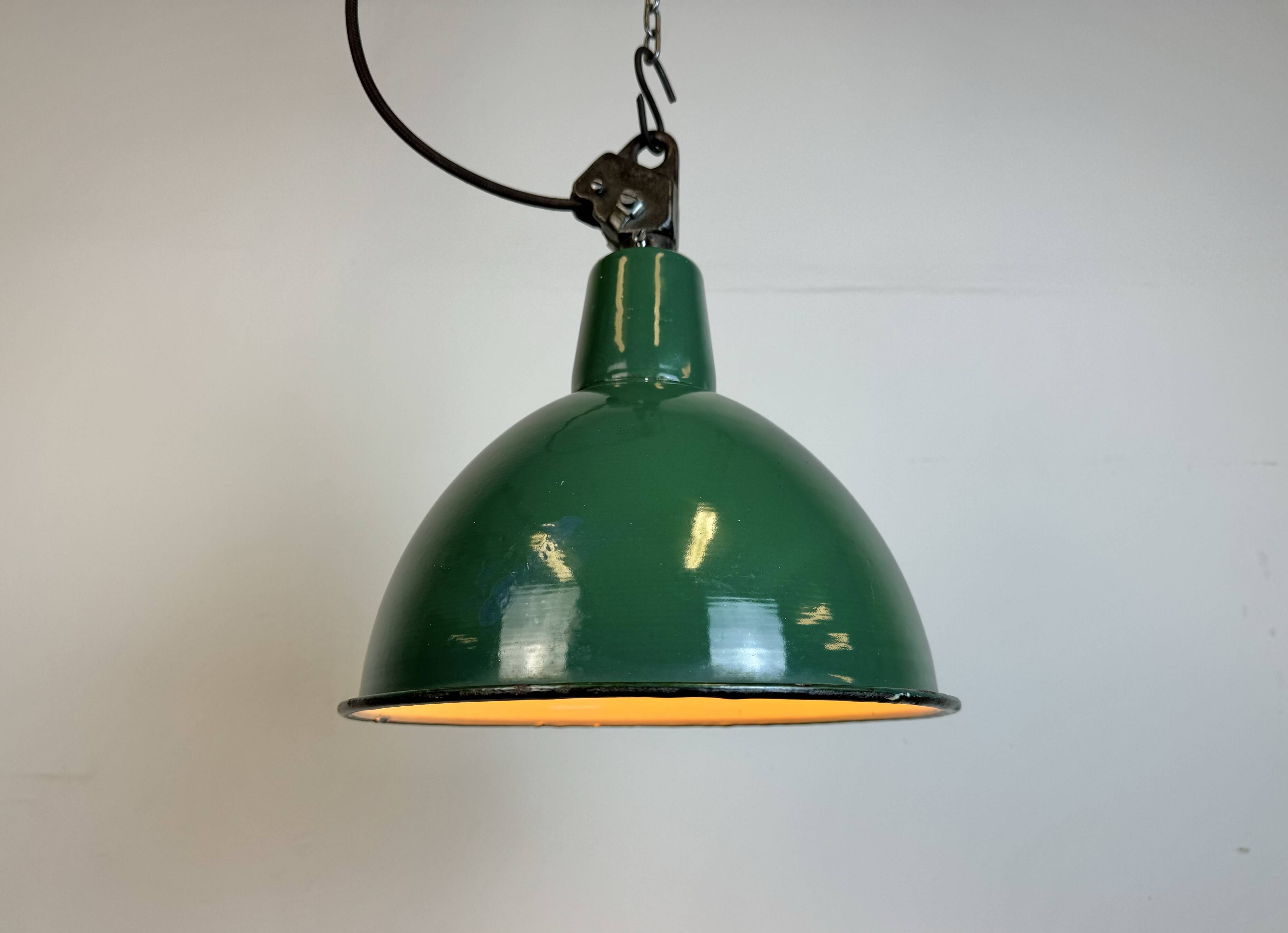 Industrial green enamel factory lamp with cast iron top, 1960s