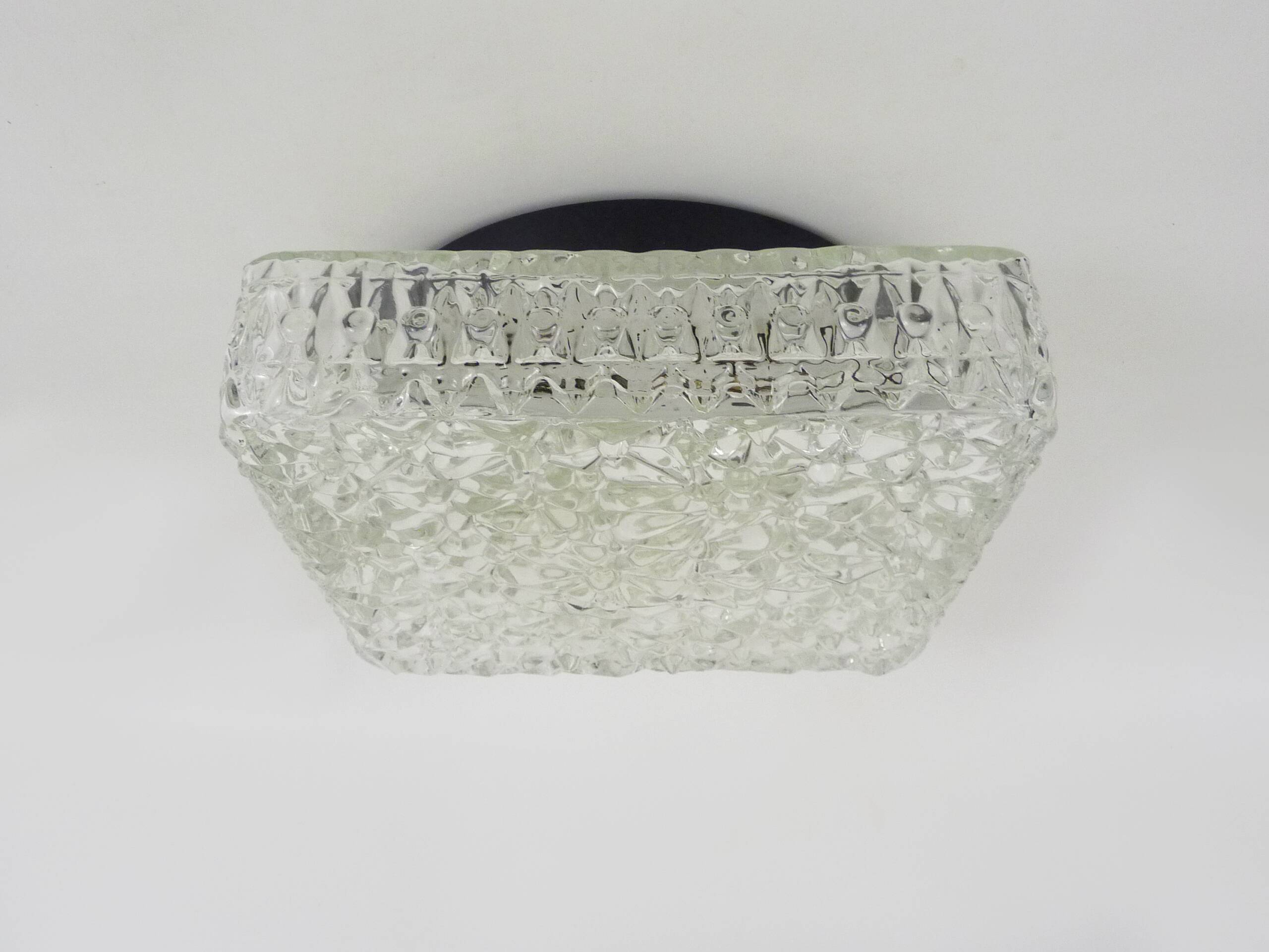 Wall lamp or ceiling light in glass and metal from the 50s and 60s.