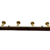 Old yellow wall coat rack