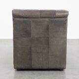 Gray leather design element/ armchair from the 70s + footstool