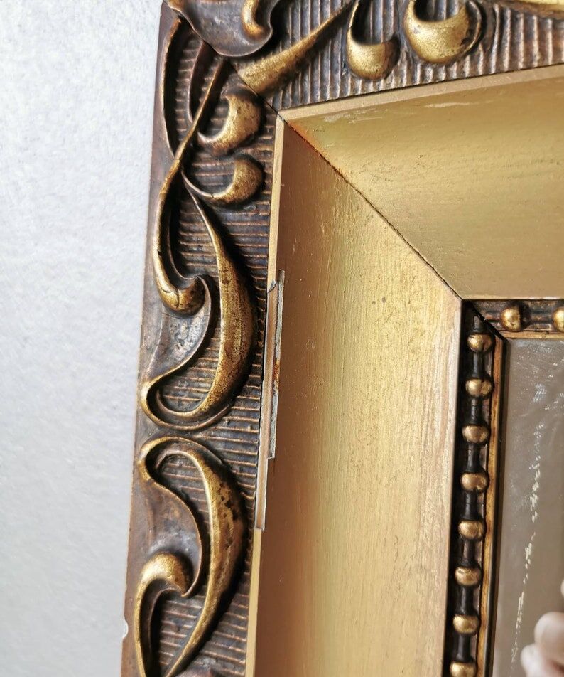 Beautiful French vintage mirror in gilded wood from the 60s