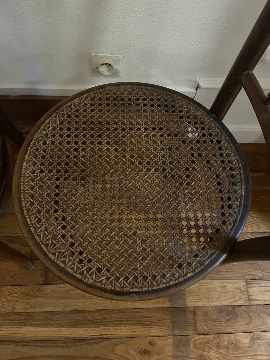 Pair of antique caned bistro chairs stamped Fischel
