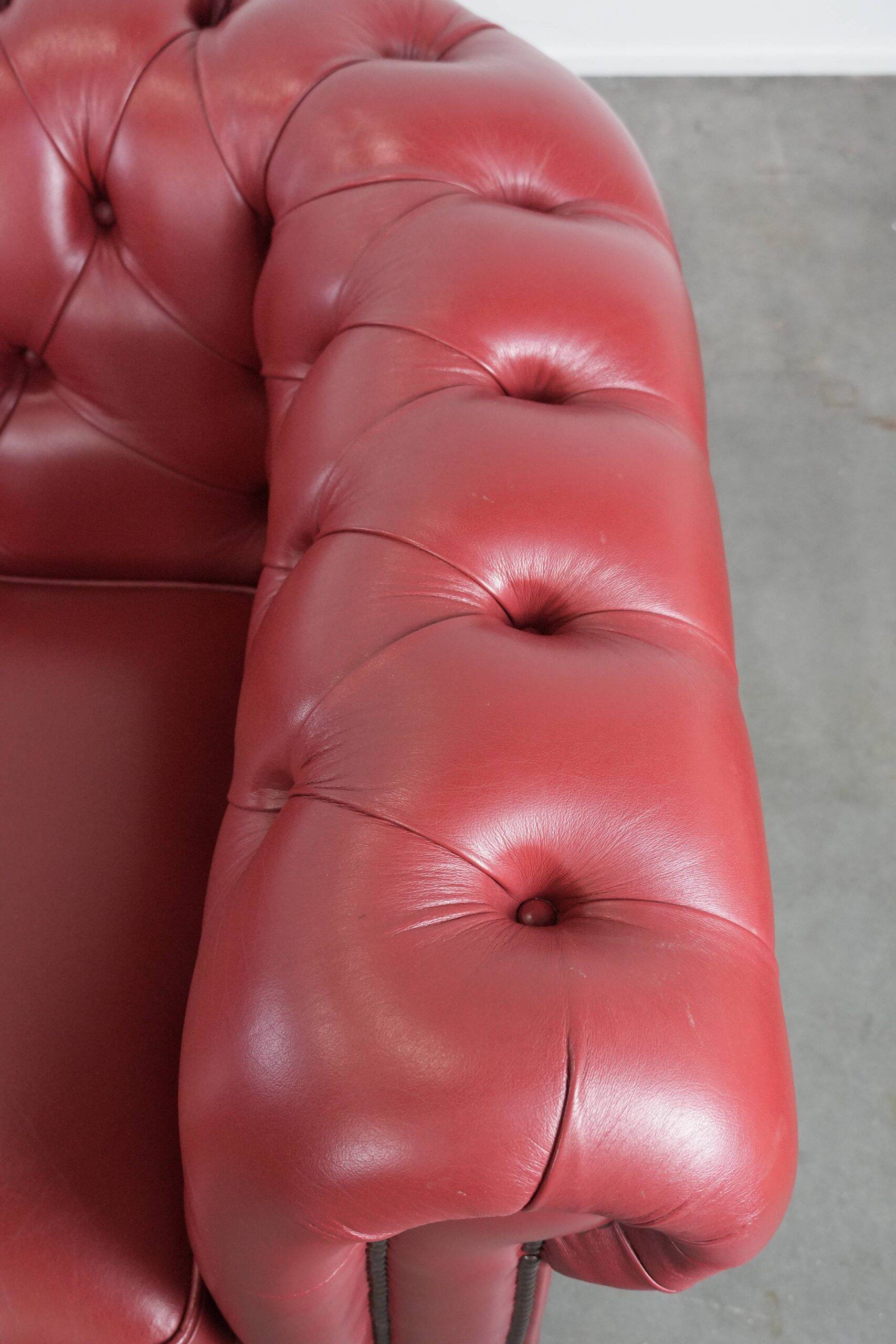 English cowhide Chesterfield 2.5-seater sofa in a stunning red colour