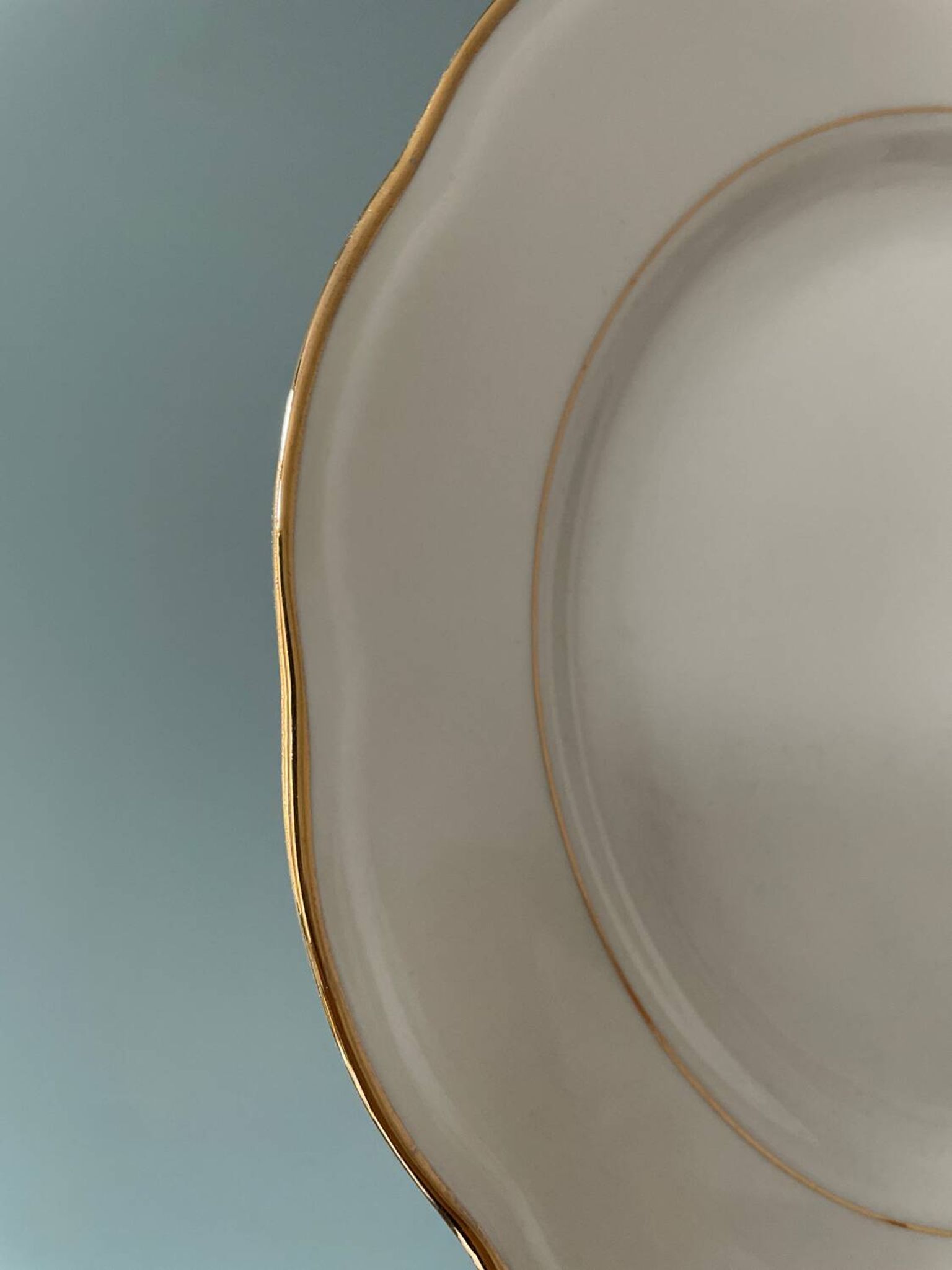 Series of 11 old flat plates in white porcelain and gold edging