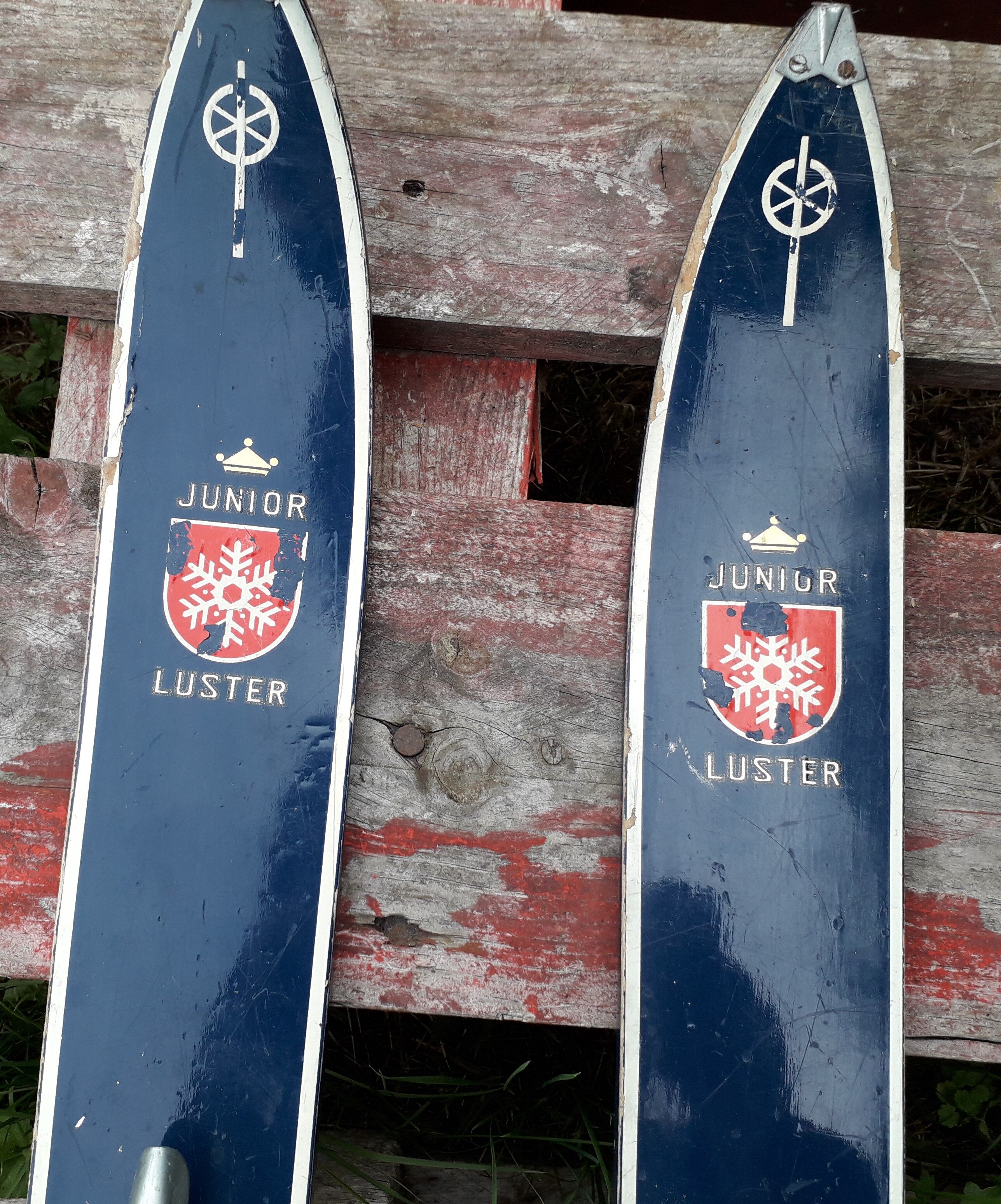 Pair of old children ski ings in blue wood