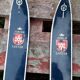 Pair of old children ski ings in blue wood