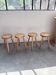 Set of 4 tripod stools in golden oak 1950