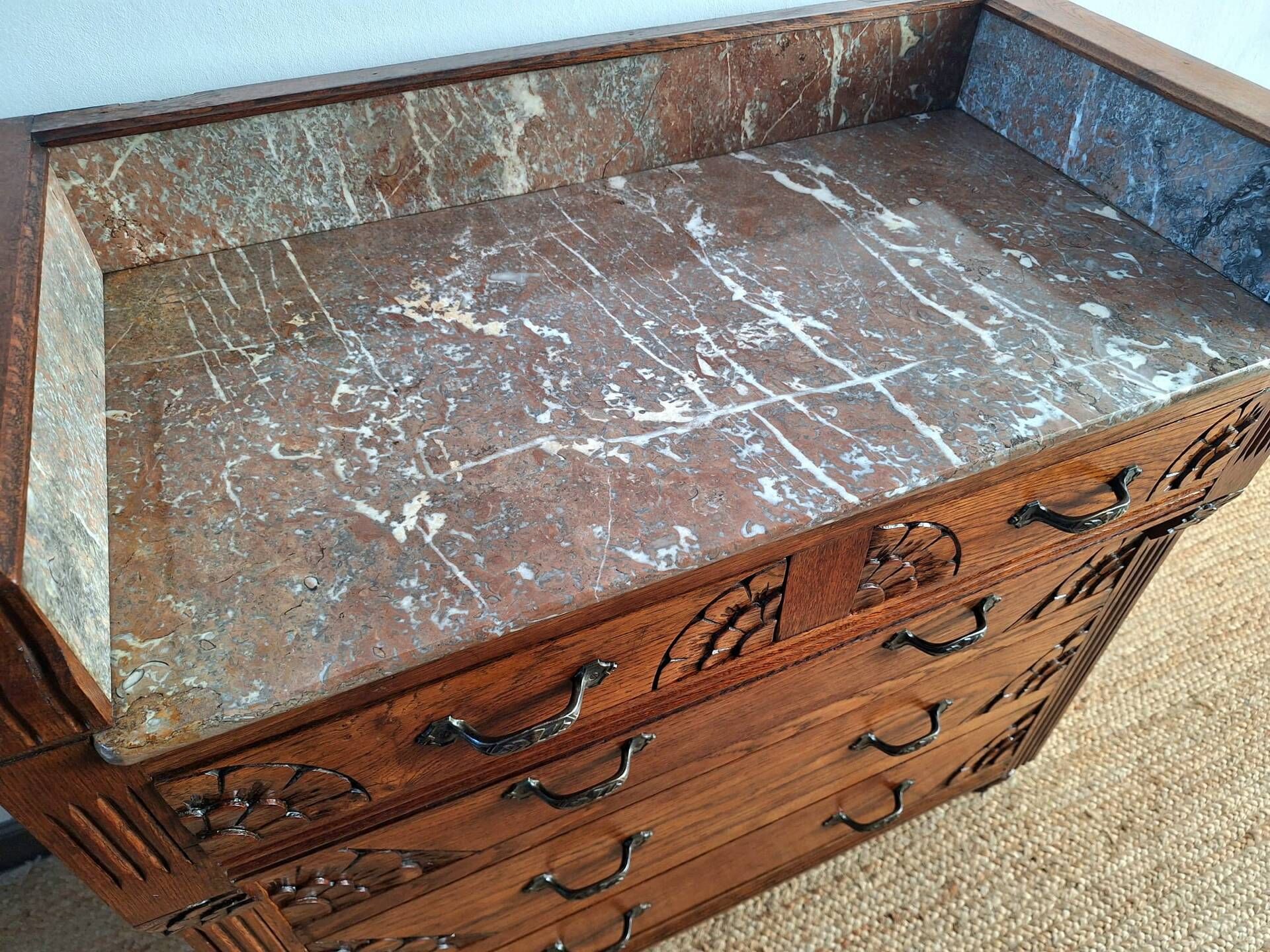 Art Deco commode with marble top, vintage antique furniture.