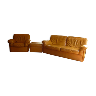 Tan leather sofa with natural graining, matching armchair and pouf