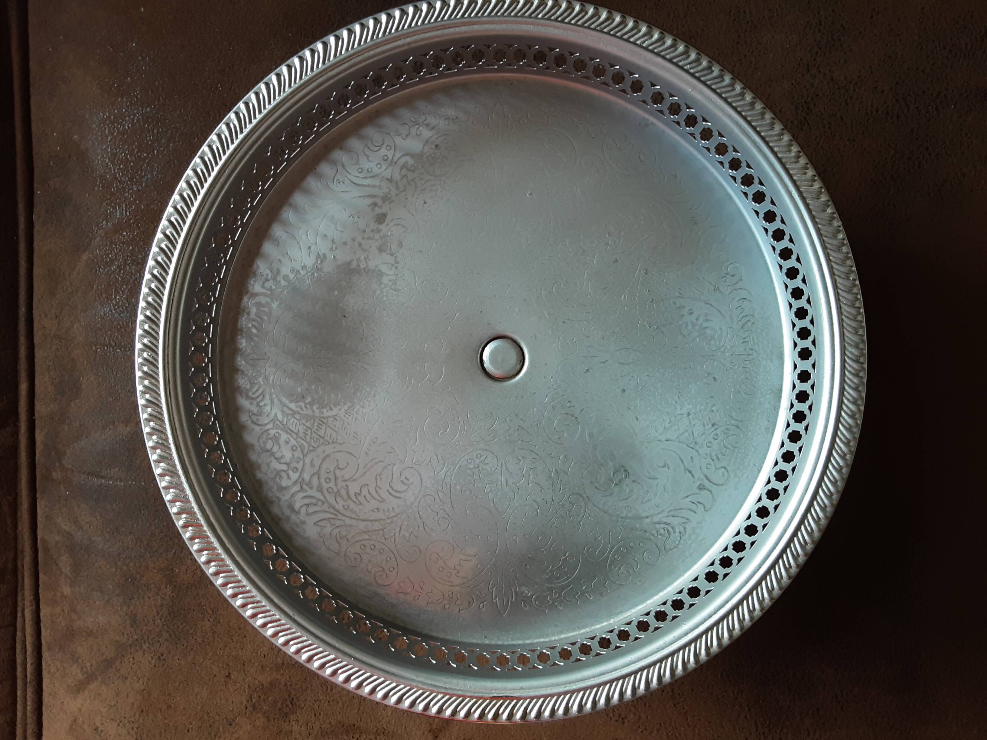 Old metal bowl on foot
