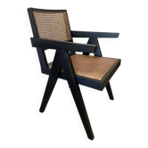 Black wooden armchair with caning