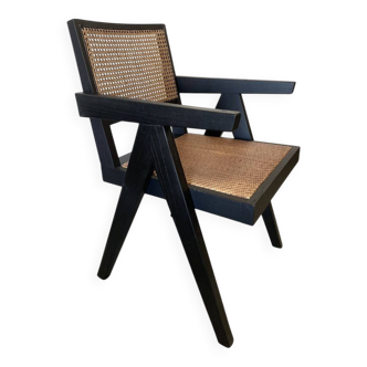 Black wooden armchair with caning