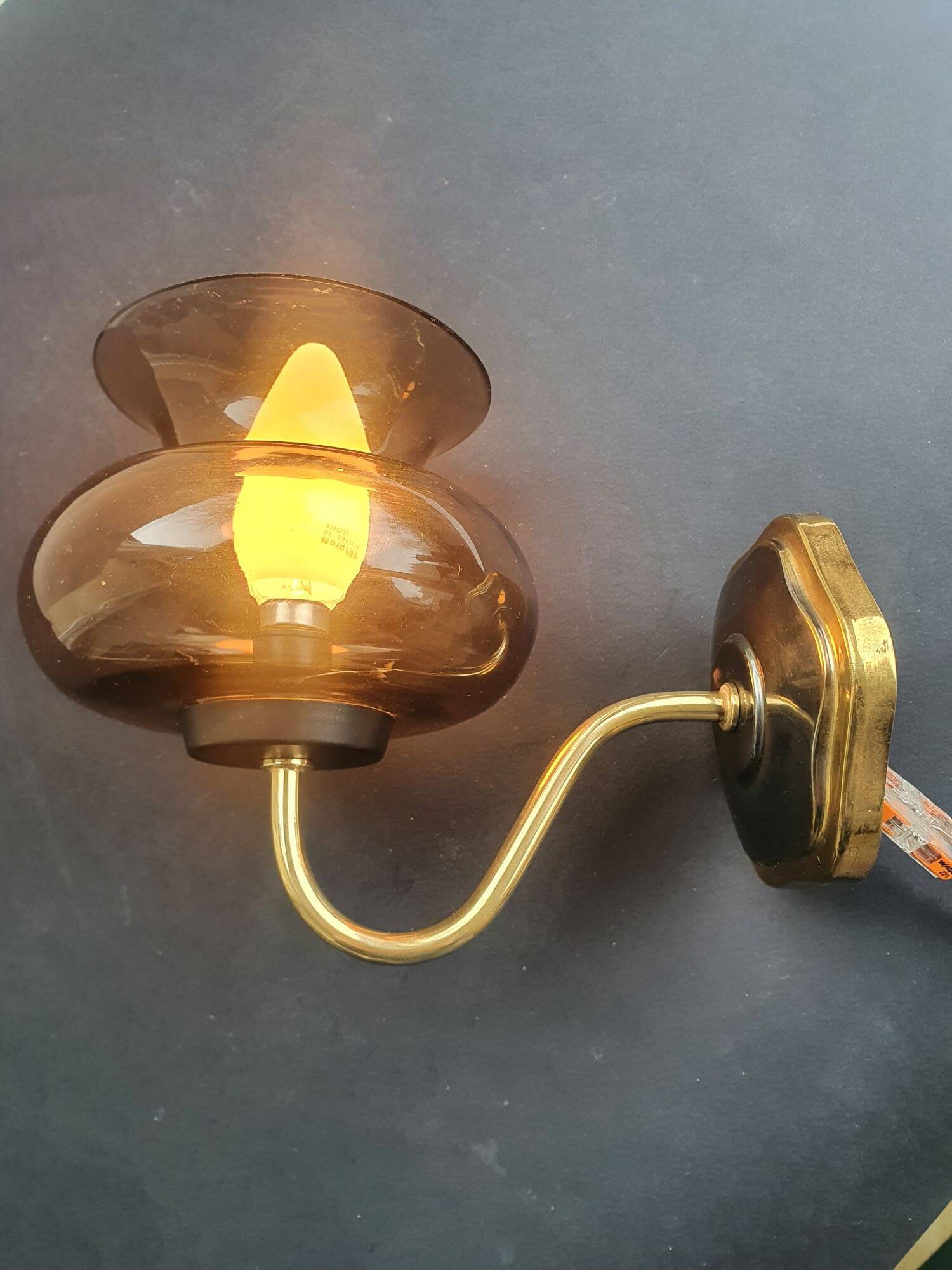 Pair of antique gold-plated brass and smoked glass wall lights.