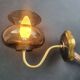 Pair of antique gold-plated brass and smoked glass wall lights.