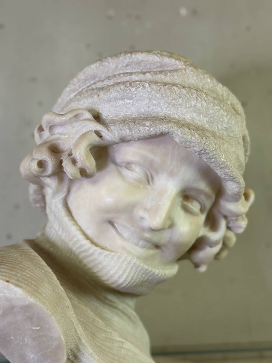 Alabaster bust of a young girl with a turtleneck, signed Caloni, Italy circa 1900