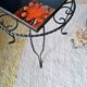 Small coffee table from the 1950s in wrought iron and glazed ceramic.