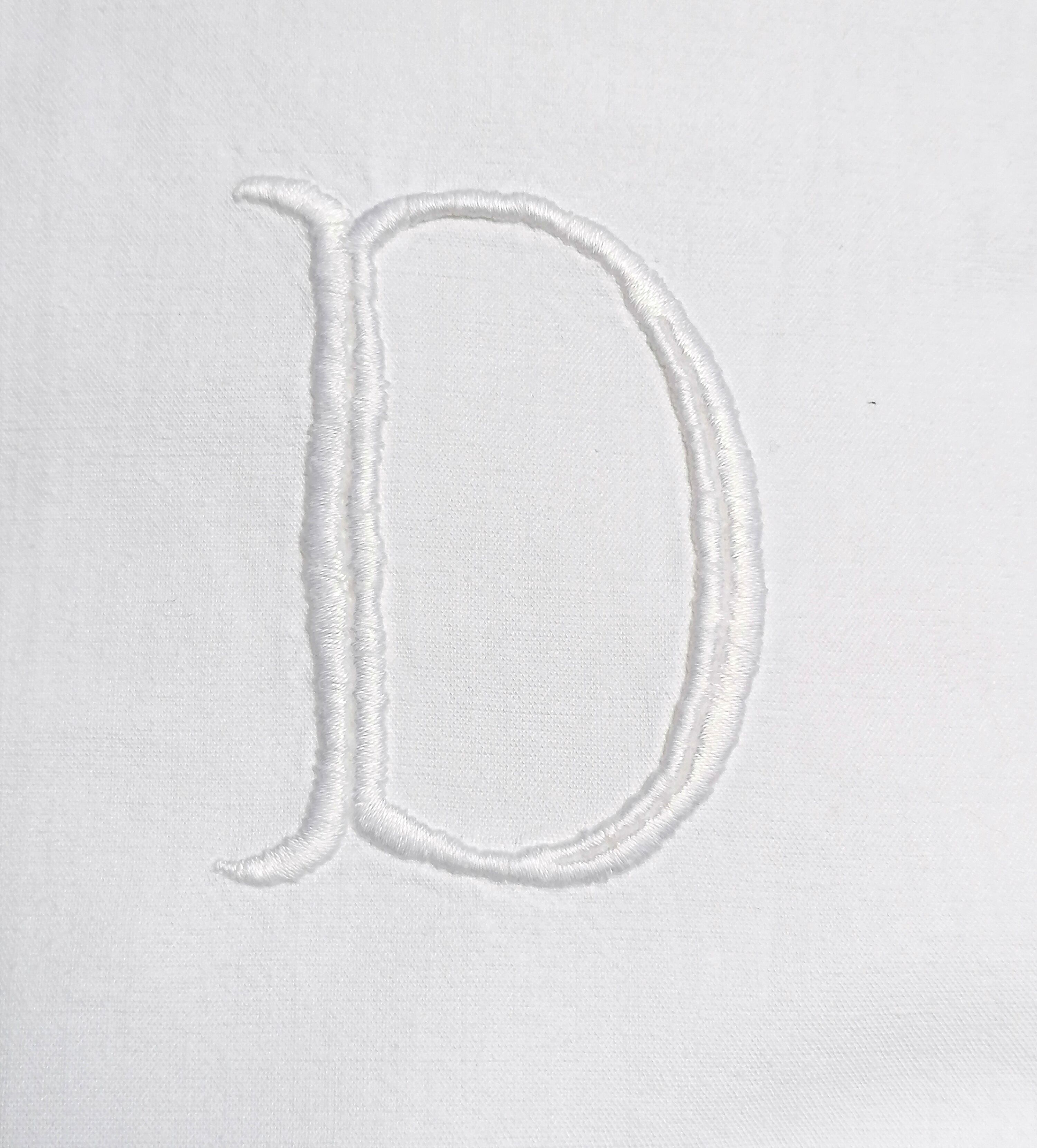 M and D monogram embroidered sheet