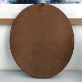 black and gold oval mirror