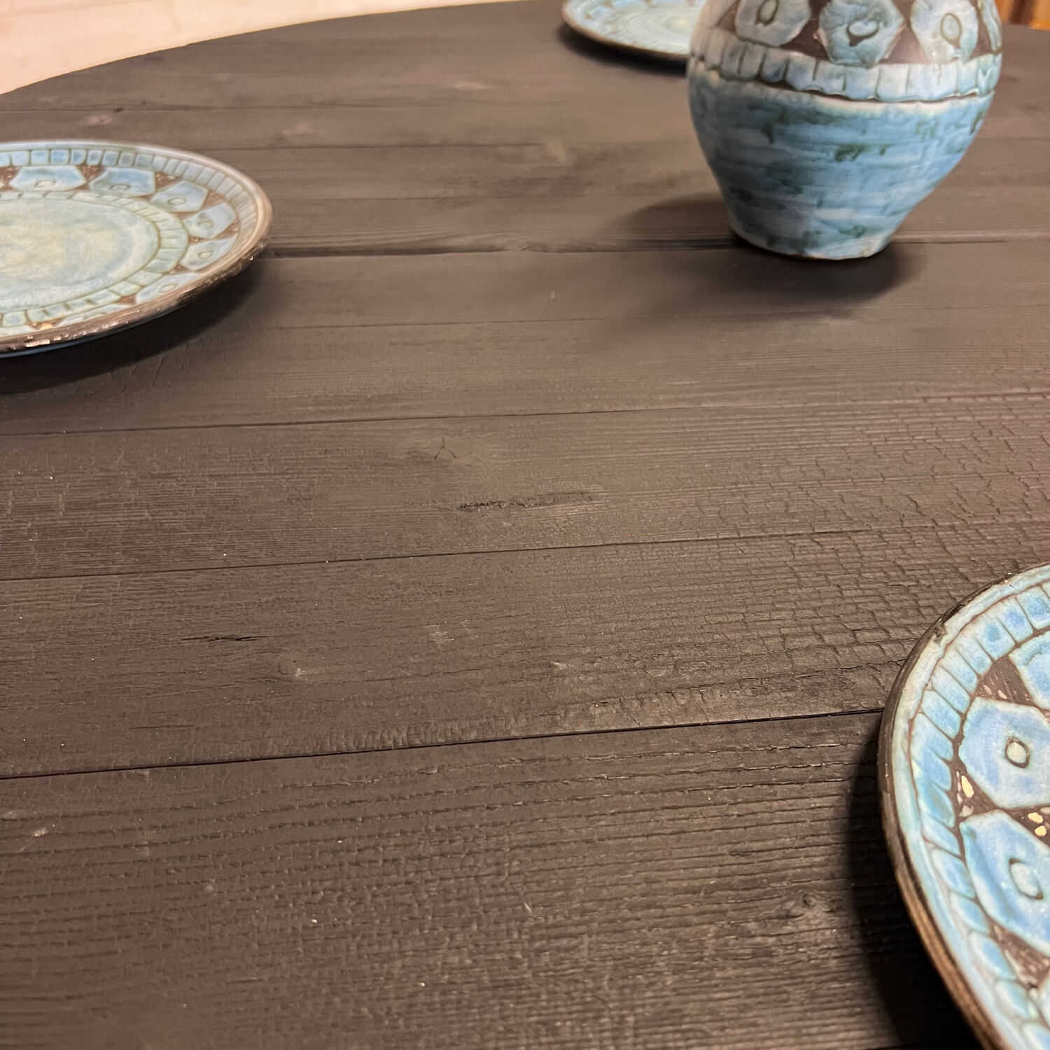 Brutalist round table in burnt wood yakisugi