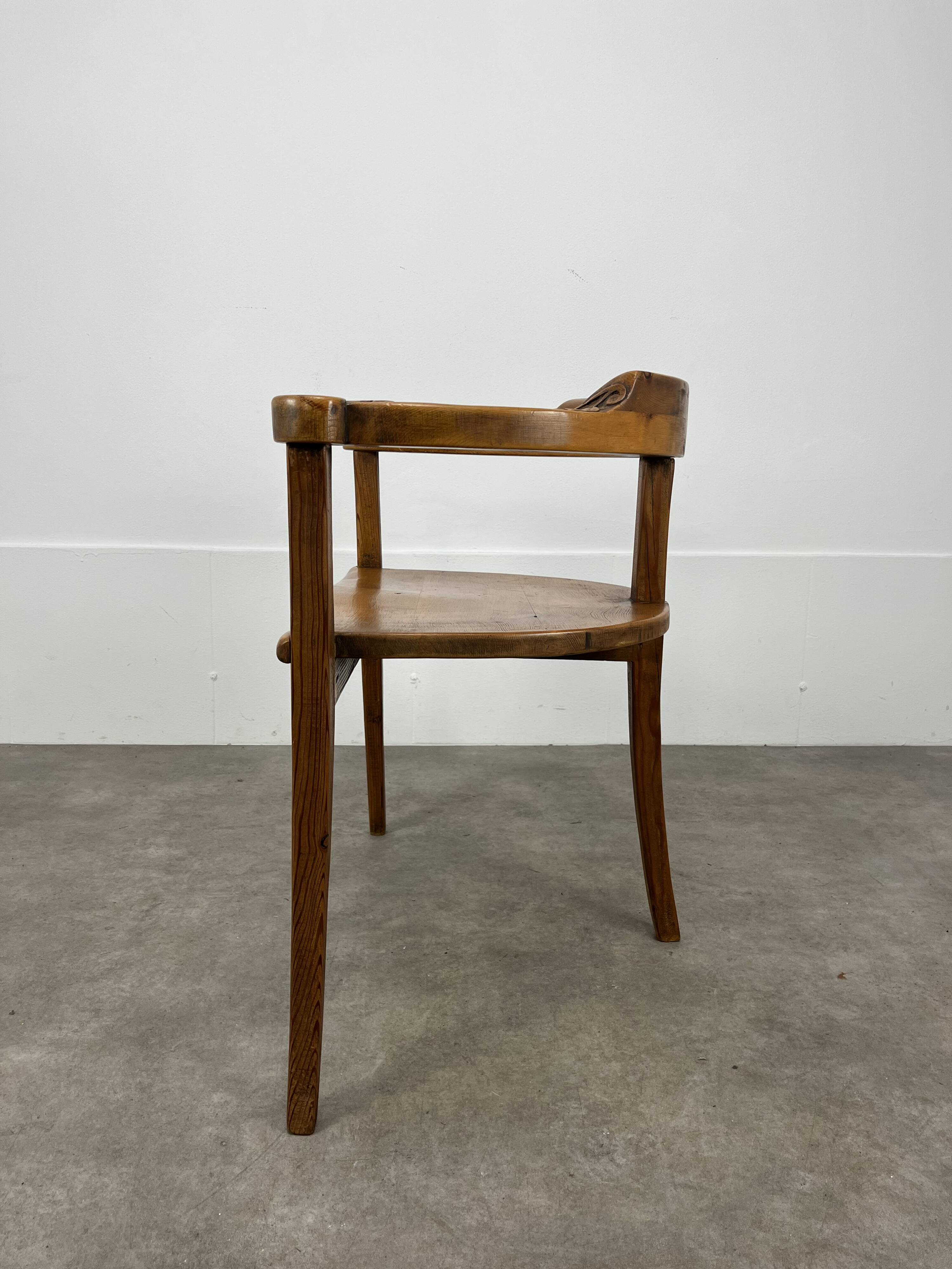 Chalet-style carved wooden tripod armchair