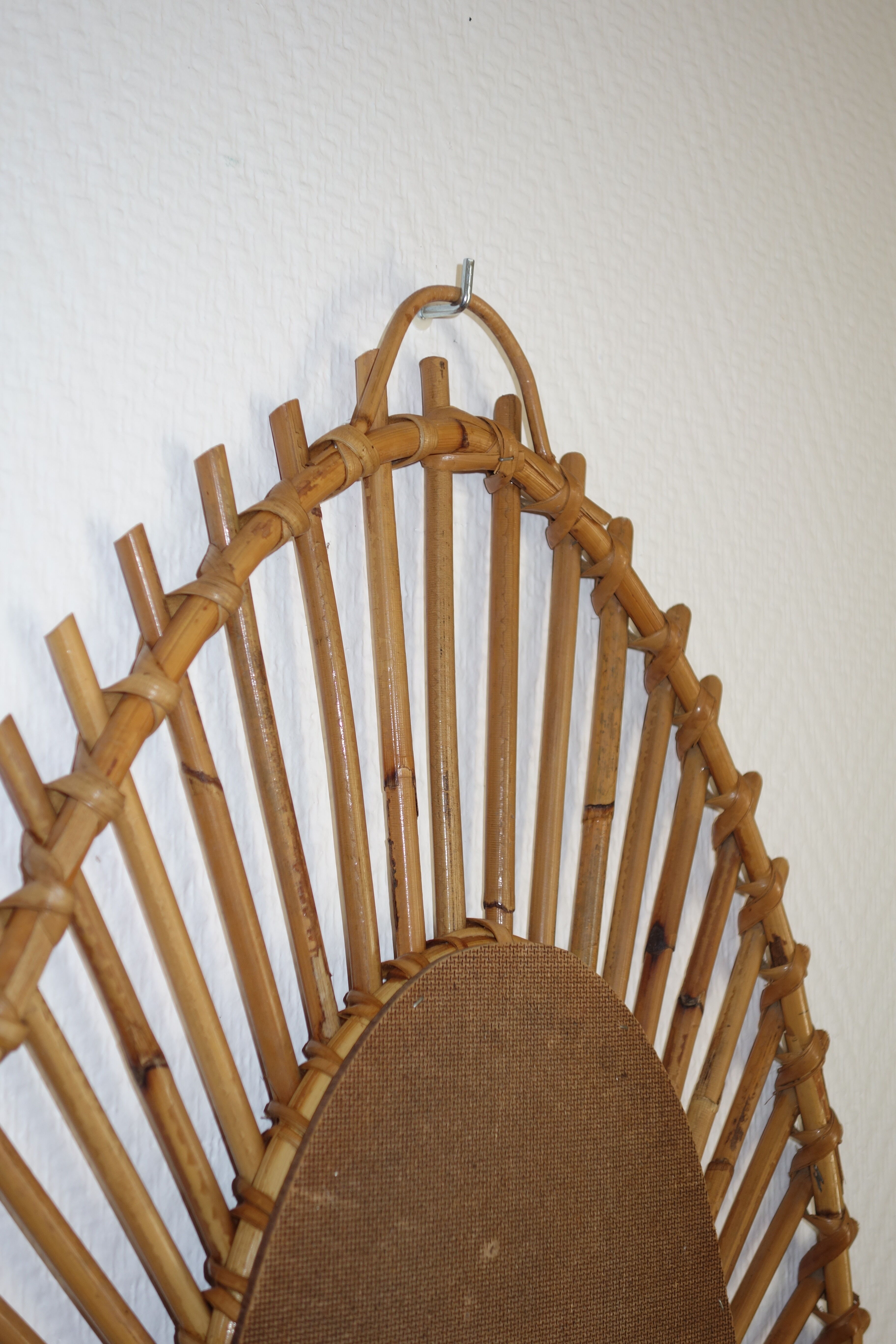Free-form sun mirror in 60s rattan