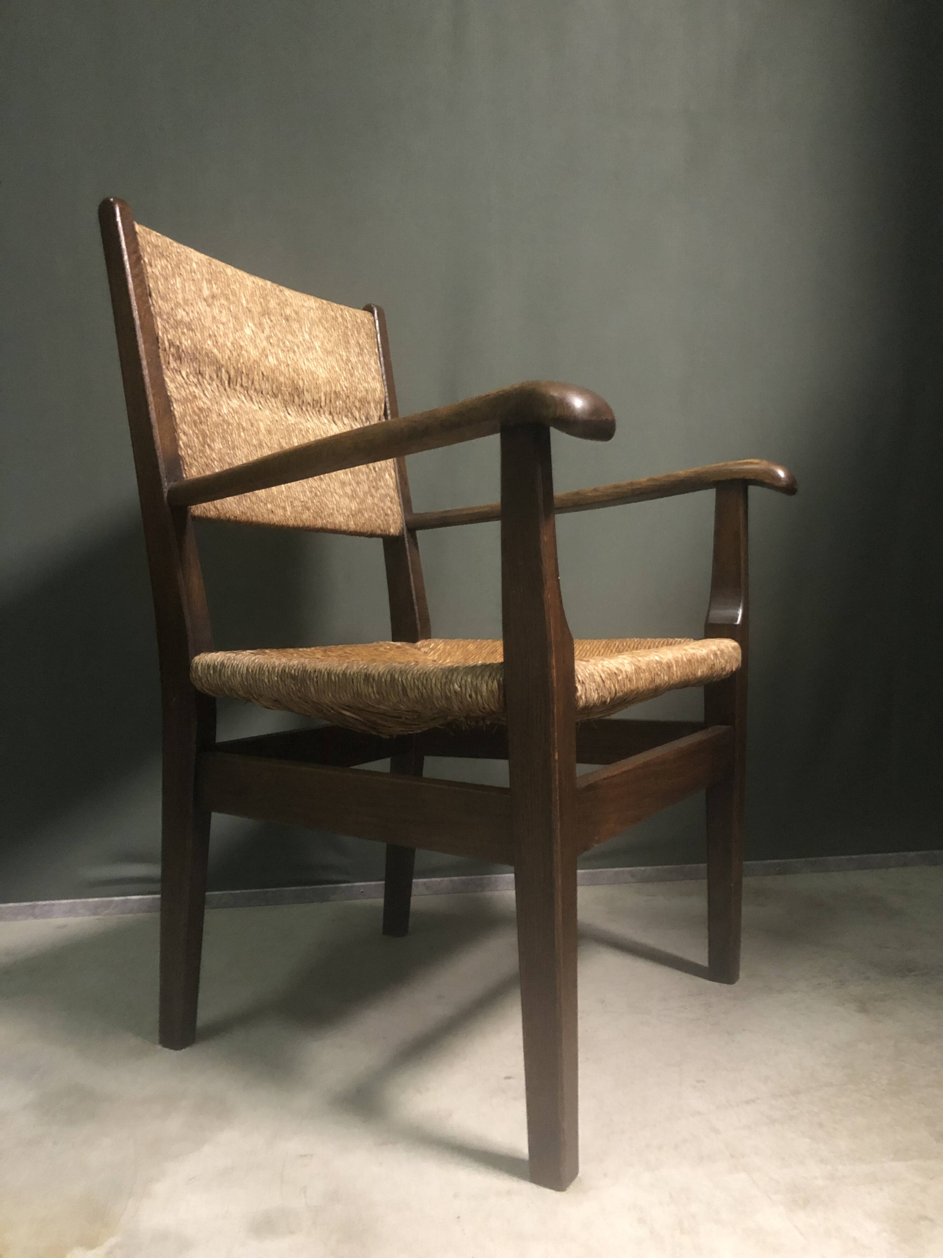 1930's Dutch oak and rush armchair.