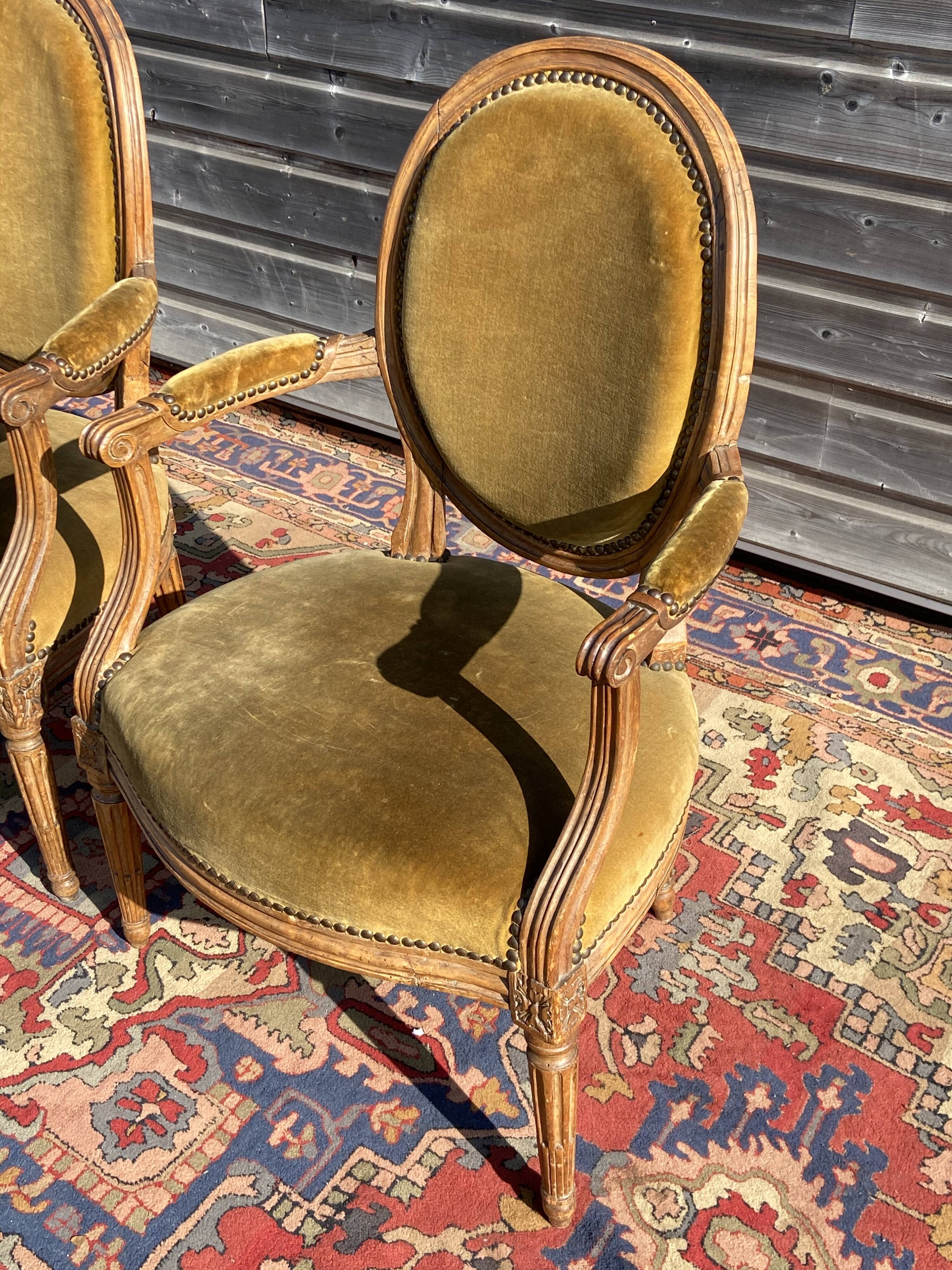 Pair of Louis XVI period medallion armchairs