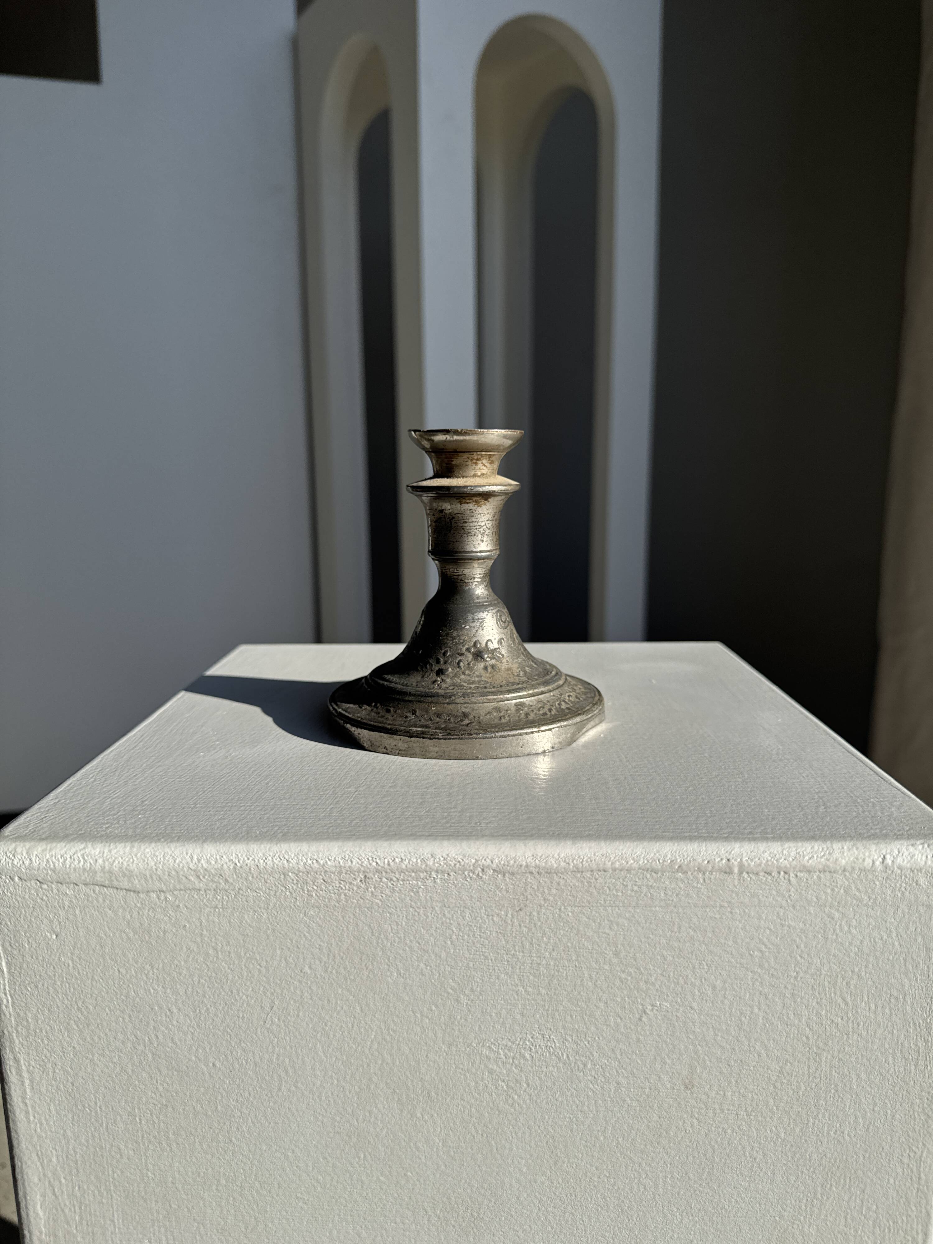 Small antique candle holder engraved in silver-plated metal, in its original condition.