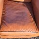 Fauteuil club des années 30 en simili cuir