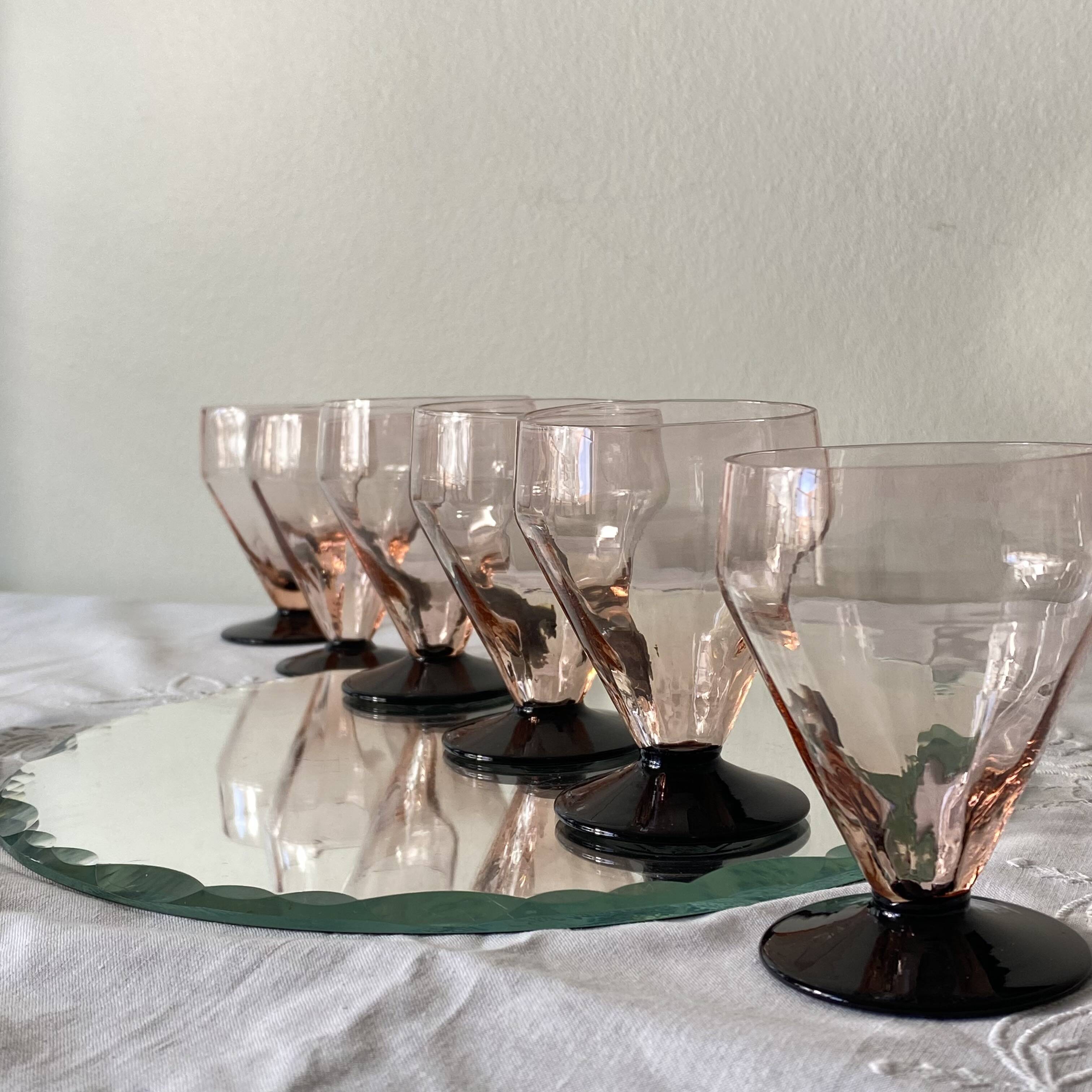 6 small Art Deco pink wine or water glasses with black stems.