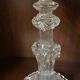 pair of cut glass candlesticks with lion and ram head decor, late 19th century