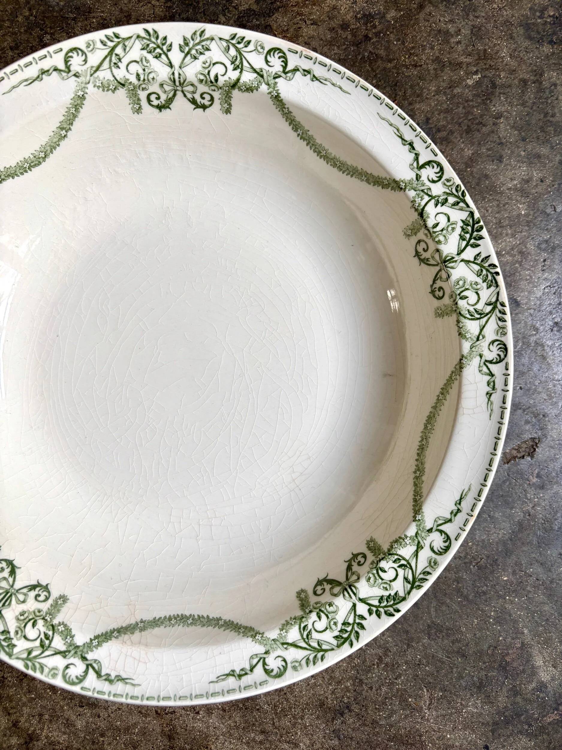 Round, deep Creil & Montereau dish in green earthenware, "Napoleon" service