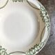 Round, deep Creil & Montereau dish in green earthenware, "Napoleon" service