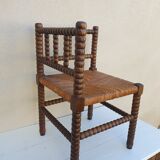 Fauteuil de coin en bois tourné façon chapelet