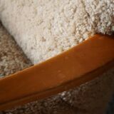 Pair of Mid Century Modern Swedish lounge chairs in birch and lamb's wool, 1960s.