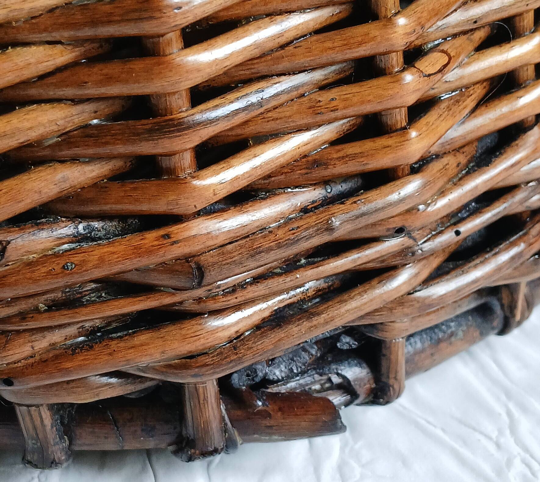 Handmade woven and dyed willow harvest basket.