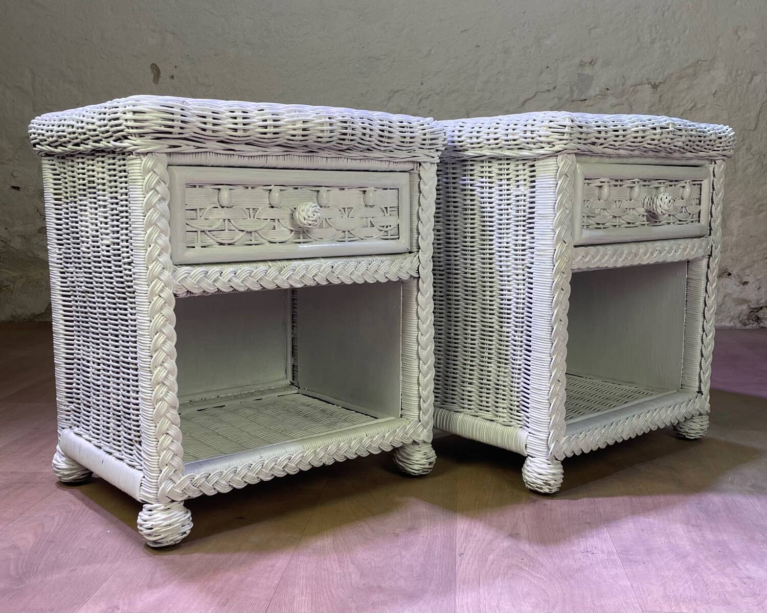 Pair of white lacquered rattan bedside tables