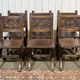 Suite de 6 chaises et 2 fauteuils en chêne et cuir à décor gothique