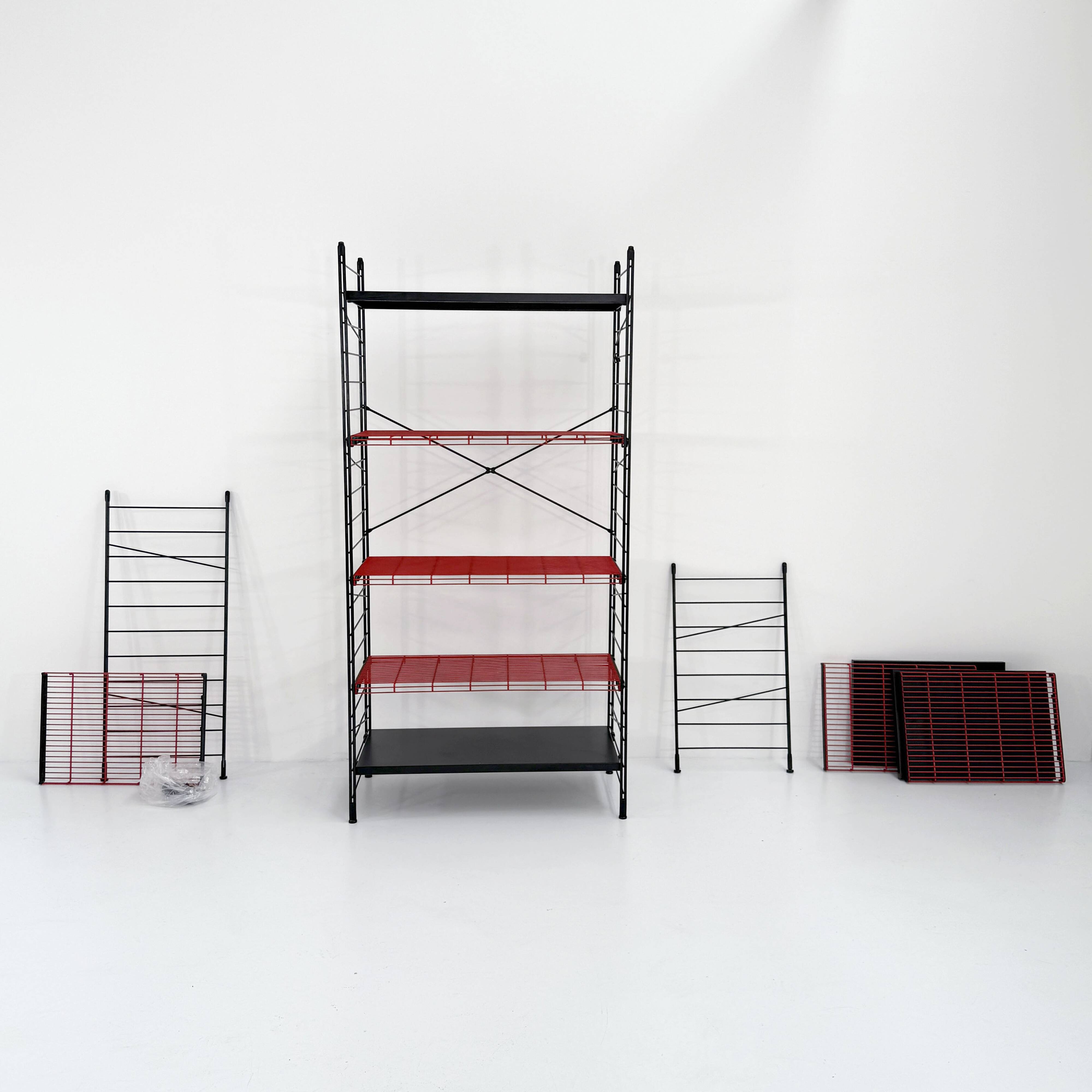Modular, postmodern, red and black freestanding shelving unit, 1980