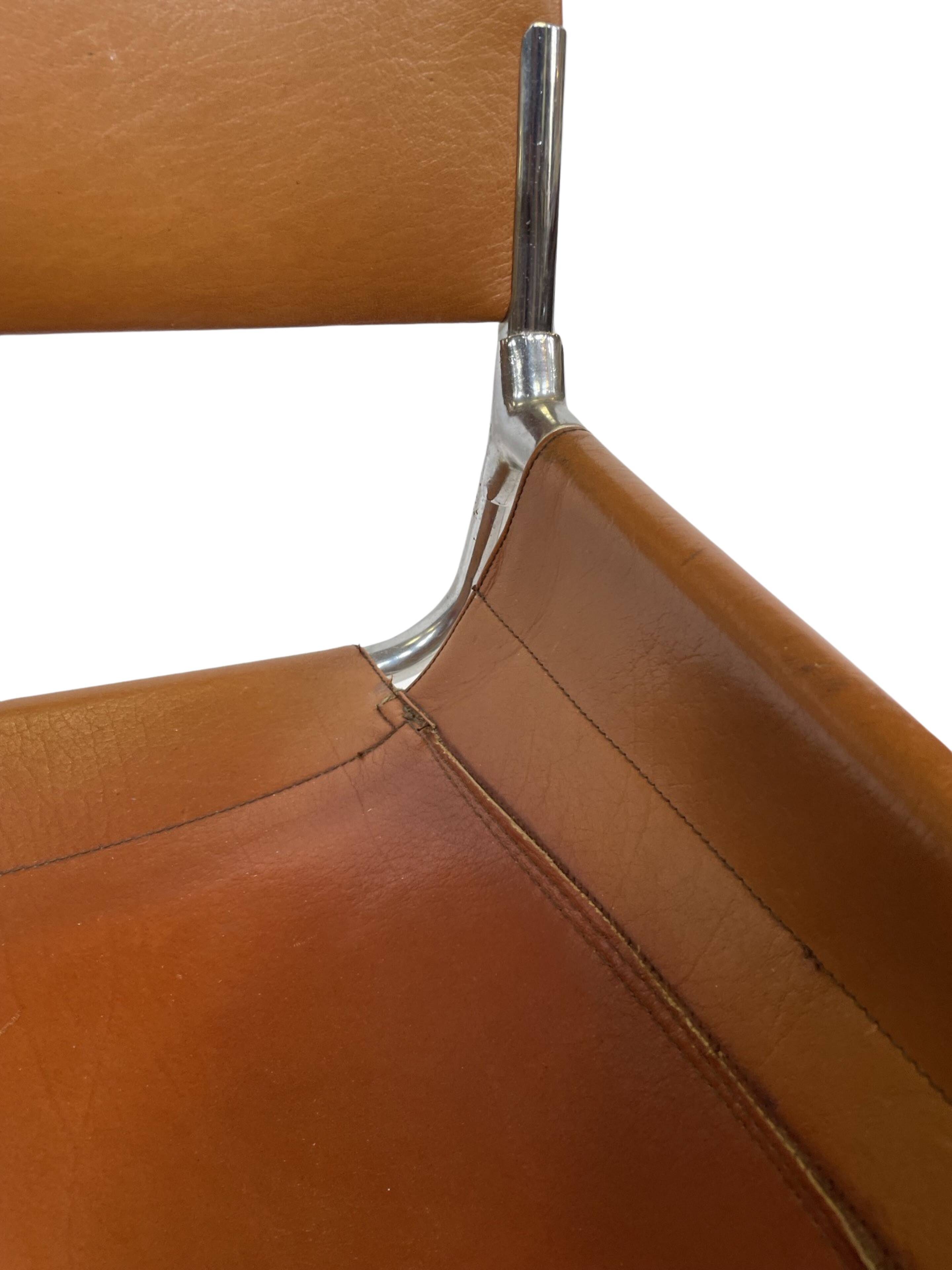 vintage dining room chair in cognac leather and chrome 1970s Italy