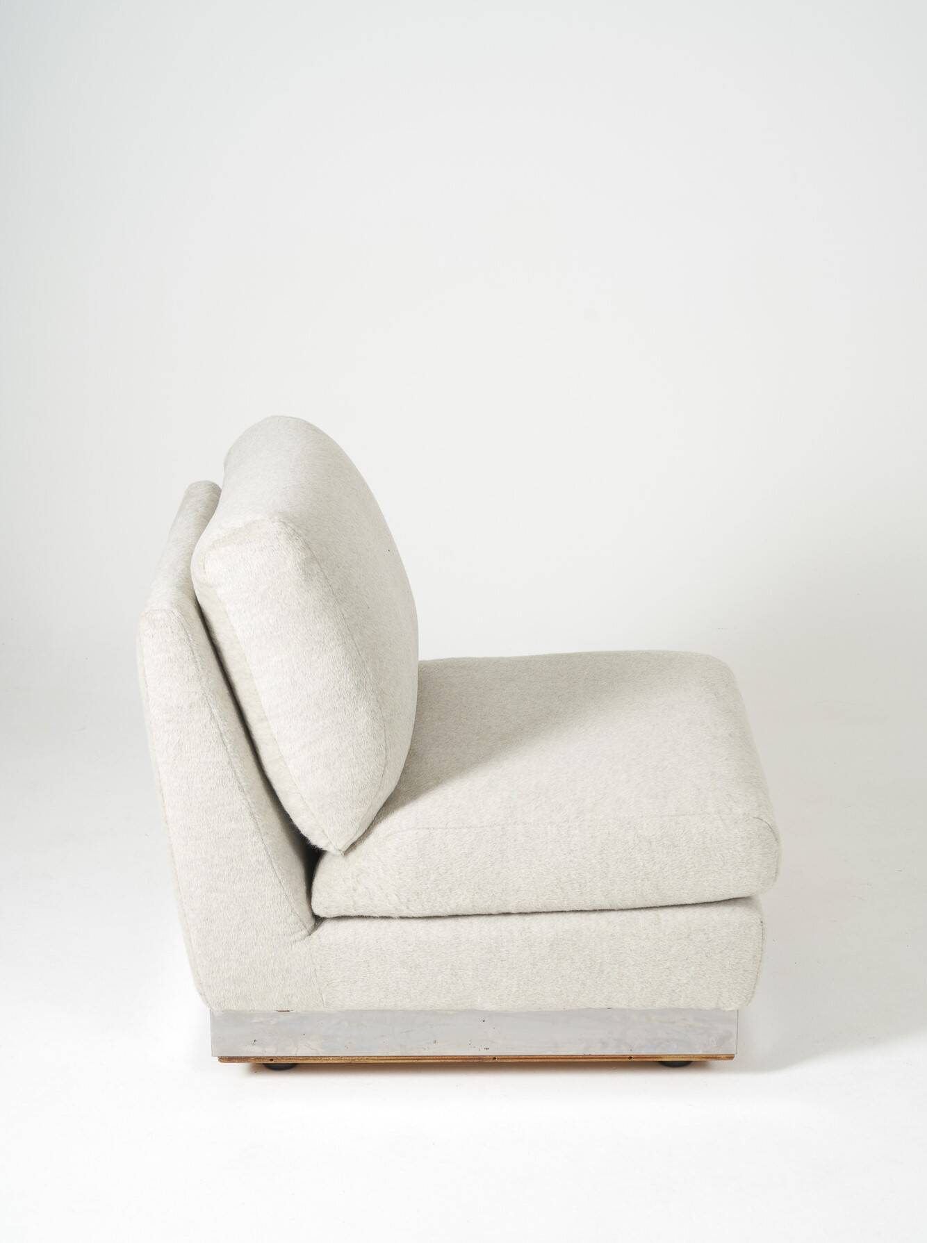 Beige fireside chair by Jacques Charpentier