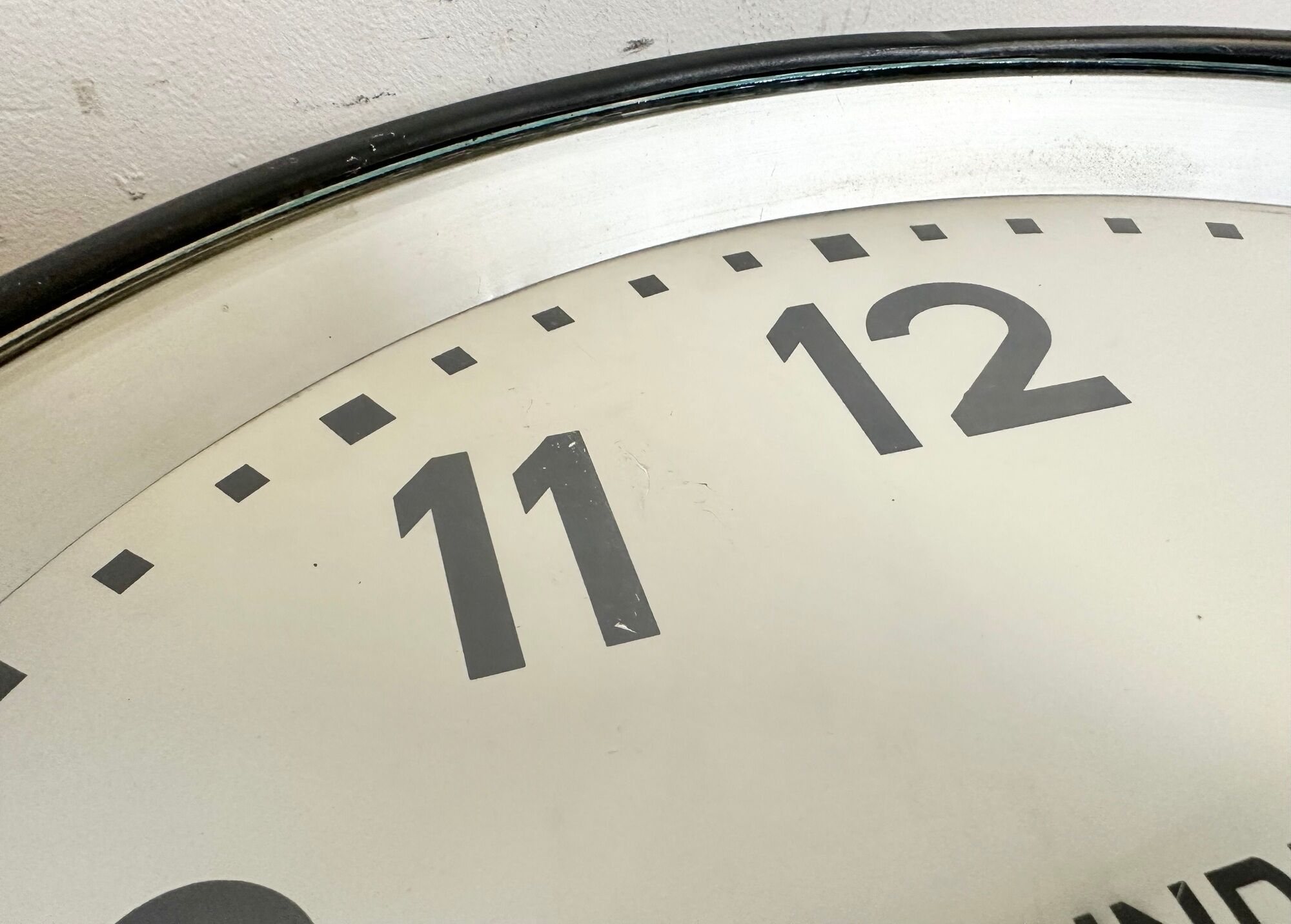 Black swiss industrial wall clock from inducta, 1960s